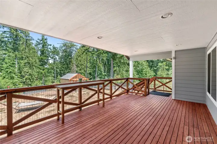 Expansive covered deck with recessed lighting overlooking fully fenced backyard. Newly stained this year. Expansive covered deck with recessed lighting overlooking fully fenced backyard. Newly stained this year.