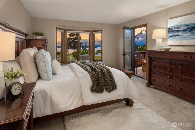 The sumptuous primary suite boasts its own deck, a walk-in closet, and a luxurious five-piece bath with a soaking tub.