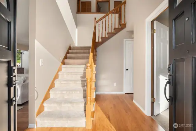 The double front doors open up to an impressive entry with grand staircase.