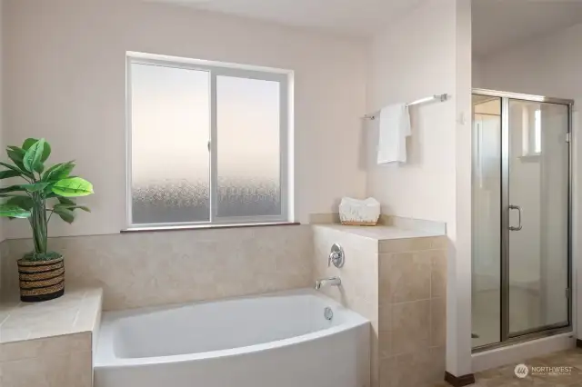 Primary bathroom showing bathtub and separate stall shower.