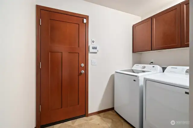 Laundry room with nice newer washer and dryer - easy access to garage.