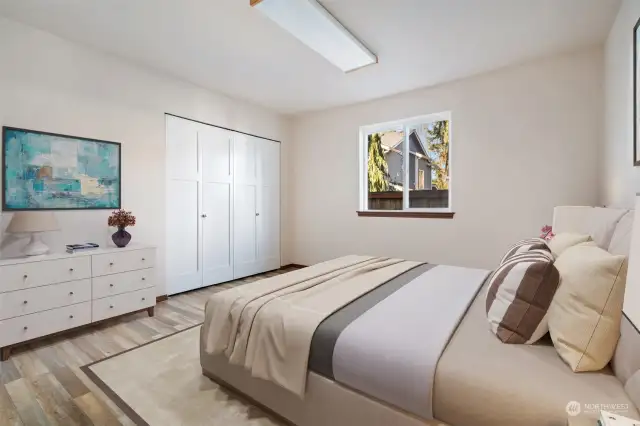 Bedroom 2 off the main hallway with nice newer flooring - Virtually Staged to give you a sense of the rooms potential.