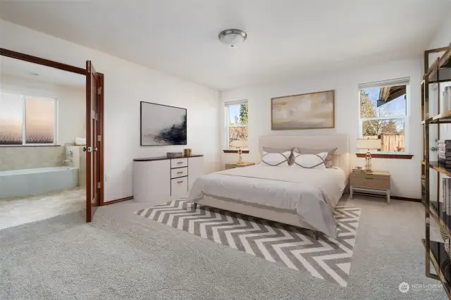 Large Primary Bedroom with double doors leading to walk in closet, large bathtub w/separate shower. Virtually Staged to give you a sense of the rooms potential.