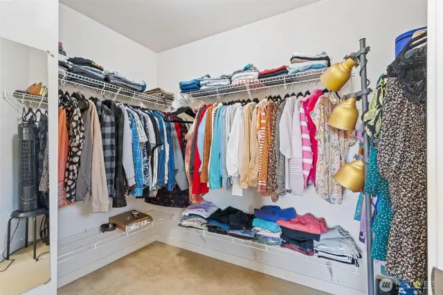 Spacious primary closet with wire shelving