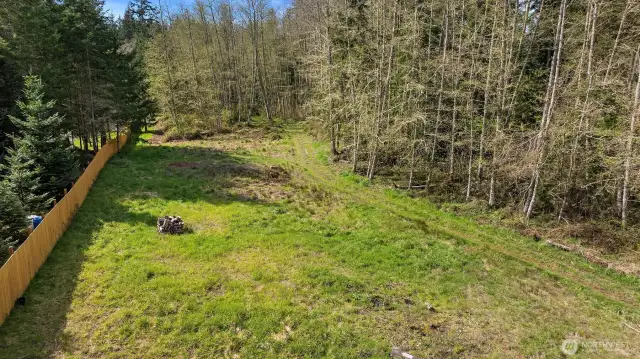 Just shy of the Greenbank Post Office as you are heading north on Hwy 525 you will find the long driveway to this ready to build parcel!