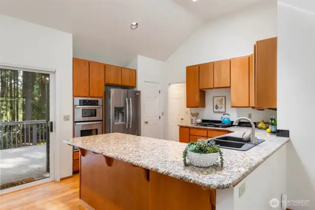 Stunning kitchen with granite counters, stainless appliances and natural gas range.