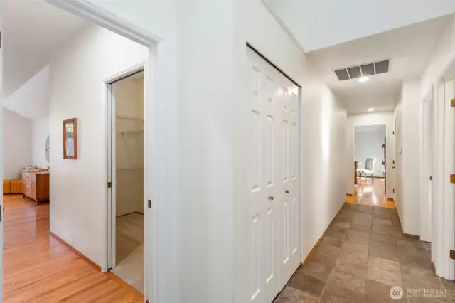 Hallway to bedrooms, primary suite to the left.