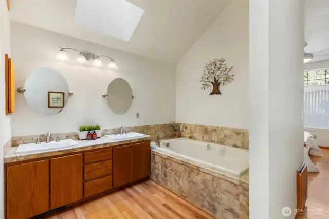 Primary bath, jetted tub, dual sinks.