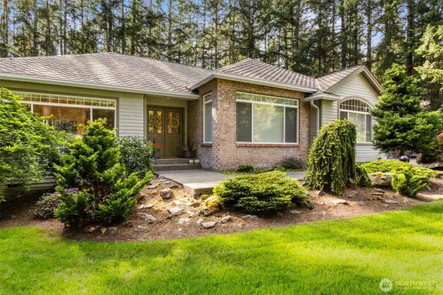 Mature landscaping thru the lot, easy path to front French doors.