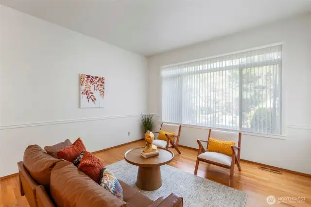 Living room 1 of 2. Custom blinds, high ceilings and great light.