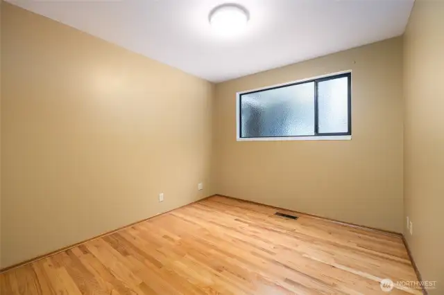1 of 3 bedrooms on the main floor. Gleaming real oak floors here also