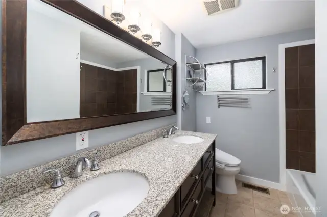 Main Bath on Main Floor. This floor has 2 bathrooms and 3 bedrooms. Double sinks and a shower/tub combo here. Another Bidet also.