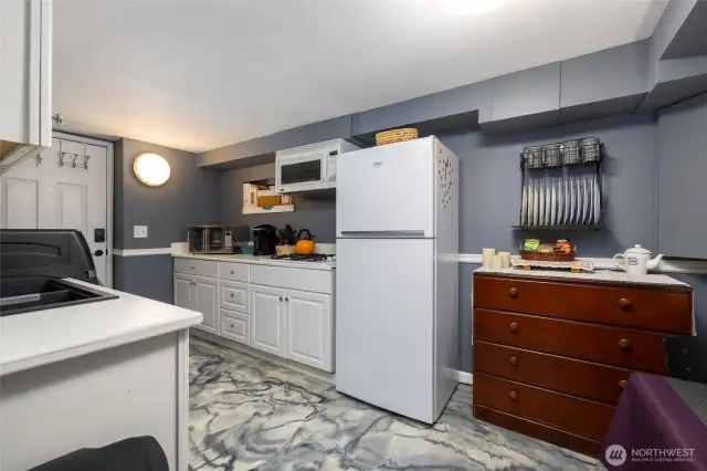 STUDIO ~ Full kitchen and dining area. Studio has it's own entries and private outside areas. Comes fully furnished.