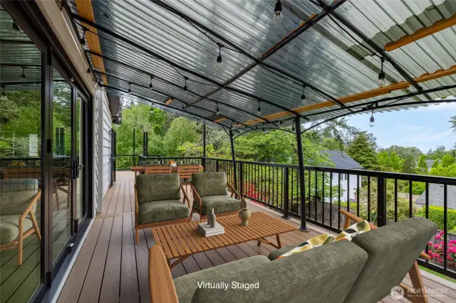 Open the whole wall of windows for a Big Party.... Tons of space on this new composite deck. There's even a gate at one area to keep pets contained !