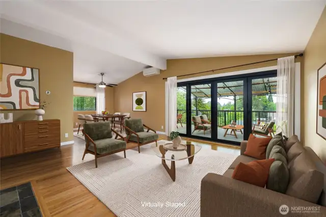 Mid Century Modern Charm !  Those HUGE doors fold completely open, so you can entertain with a flow of people in and outside of the home. HUGE new composite decks make this a proud place to enjoy. virtually staged