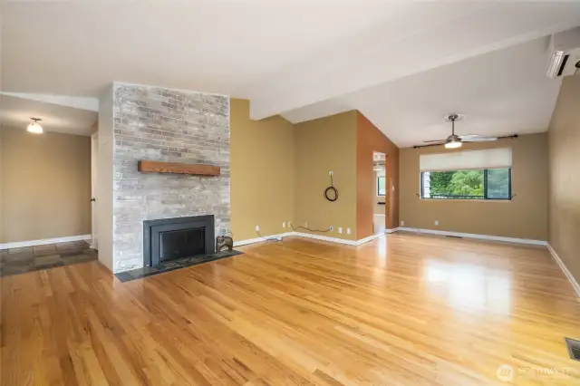 Here is the un-staged Living and dining area. Gleaming REAL OAK Floors and Cabinets in the kitchen.