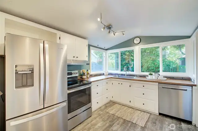 Keep an eye on the backyard from this sunny kitchen