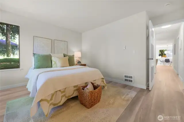 The primary bedroom is large and light and bright