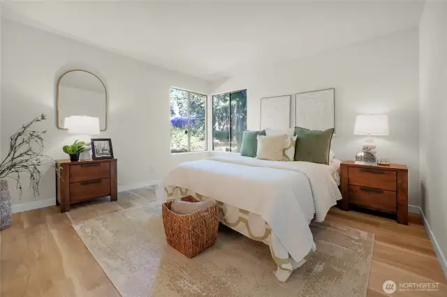 The primary bedroom is large and light and bright
