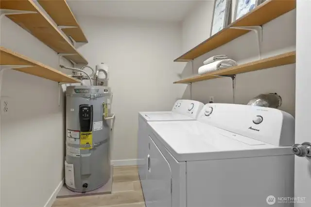 The utility room is spacious and has a new hot water tank