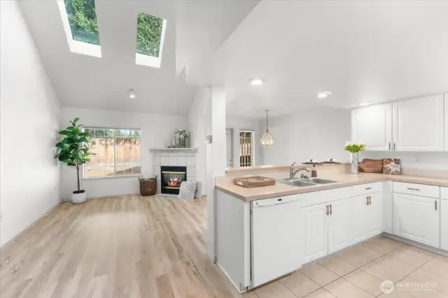 Entering Open Family Rm to Dining and Kitchen