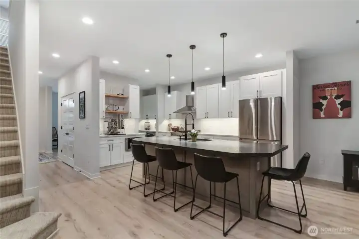 9 foot ceilings, ample windows and light color tones provide uplifting mood and open feel