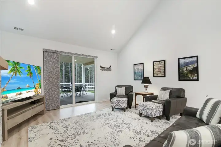 Family room off the kitchen is vaulted for an open feel, while designed for a cozy feel