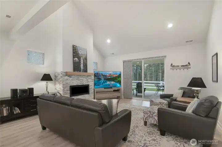 Vaulted family room with custom stone fireplace mantel