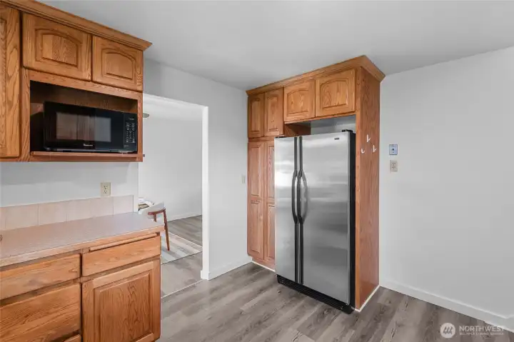 KITCHEN | There's the fridge! And right next to it on the wall is that essential outlet for an old-school landline telephone. Avocado green anyone? Not quite pictured is the staircase to the right leading up to the bedrooms.