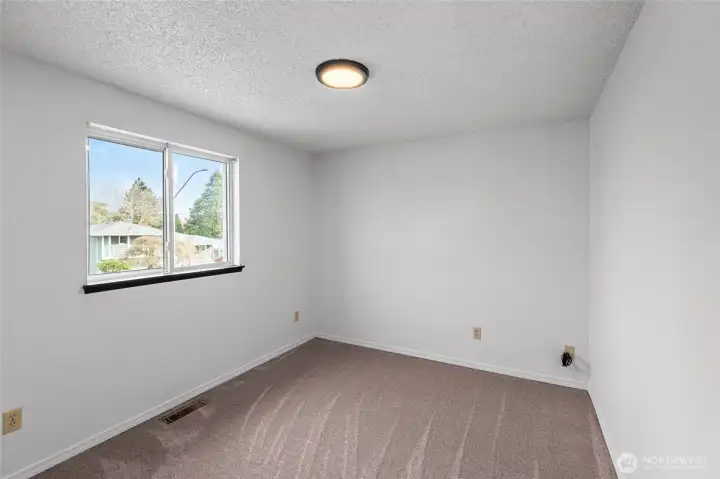 BEDROOM 3 | Located at the front right corner of the home.