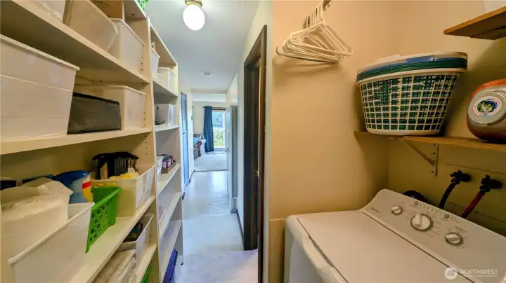 Utility space provides ample storage, laundry and exit to the back yard.