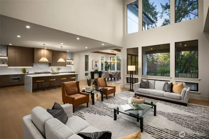 Two story great room with a wall of floor to ceiling windows