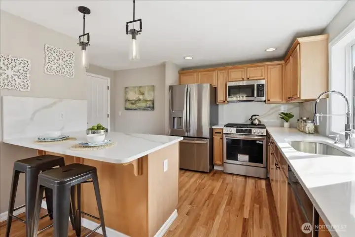 Easy functional layout, prep area, Quartz backsplashes, too!