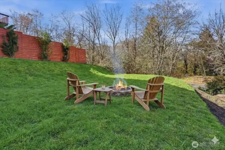 Lower yard has many fun uses! Home sits on Over a third of an Acre!