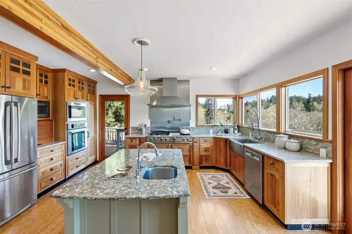 Chefs kitchen with abundant wood and modern updates. Chefs kitchen with abundant wood and modern updates.