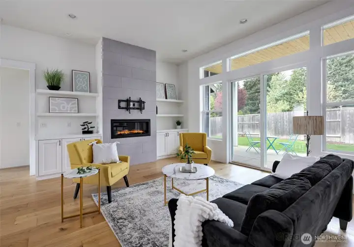 Great room, tile, gas fireplace, engineered hardwood floors, built-in shelves, French doors to covered patio