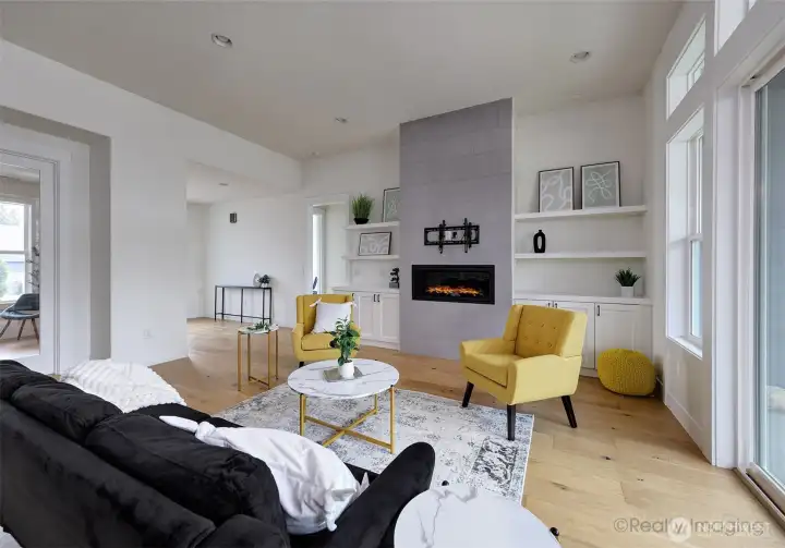 Great room, tile, gas fireplace, engineered hardwood floors, built-in shelves, French doors to covered patio