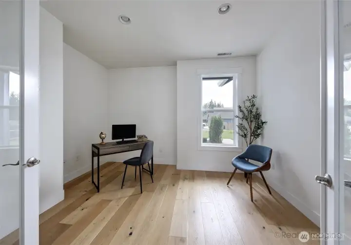 Den/office w/ French doors and engineered hardwood floors