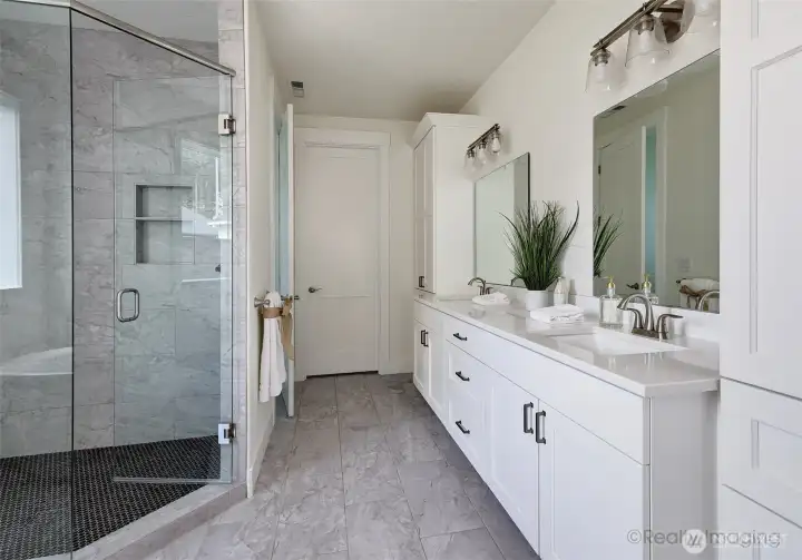Primary suite, walk-in tile shower w/ glass door, soaking tub, double quartz vanity