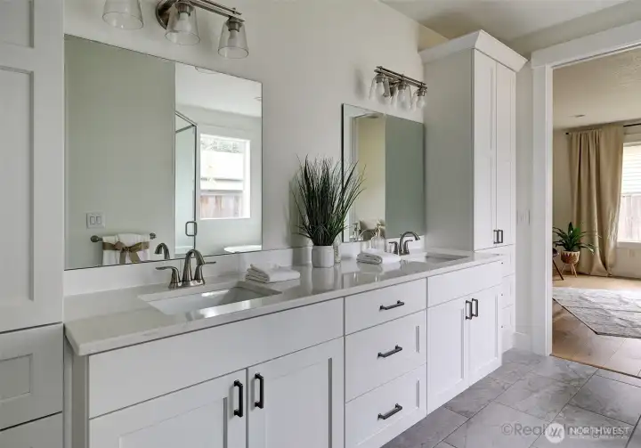 Primary suite, walk-in tile shower w/ glass door, soaking tub, double quartz vanity
