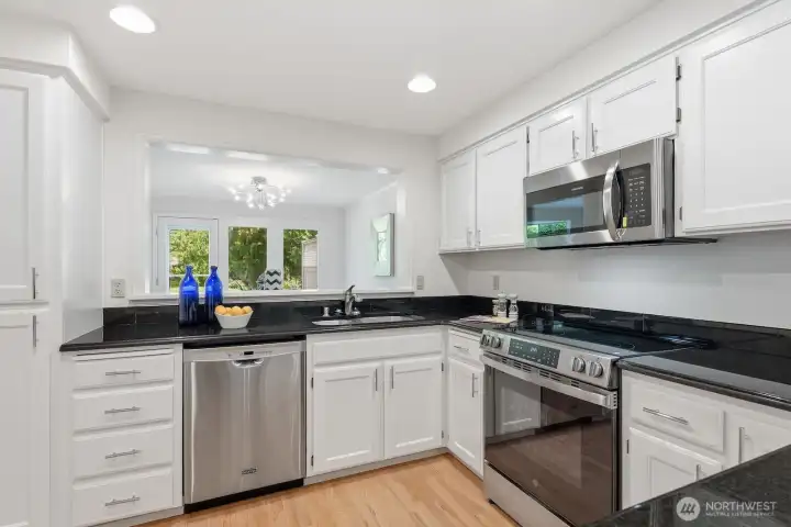 Classic white cabinets, stainless & granite