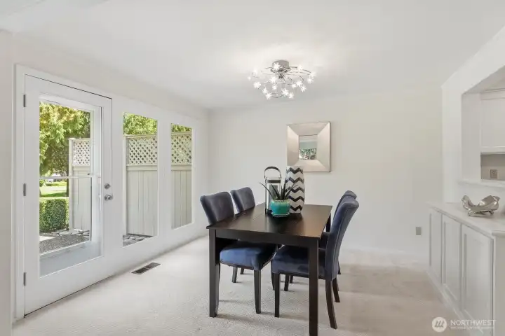 Storage buffet and french doors to patio