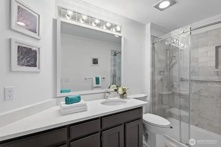 Recently refreshed walk in shower and marble tile
