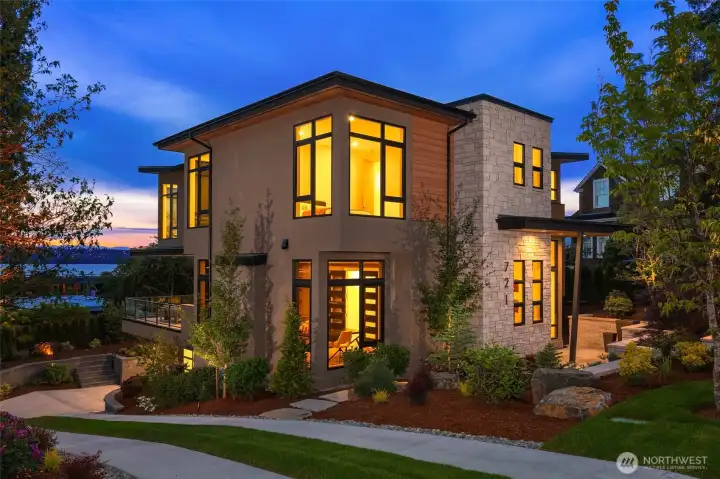 Stunning exterior details with a mixture of true stone, Trespa Pura siding, and Elastomeric true stucco