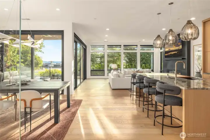 10 feet ceilings and floor to ceiling windows bring light and drama to you great room inspired main floor living spaces