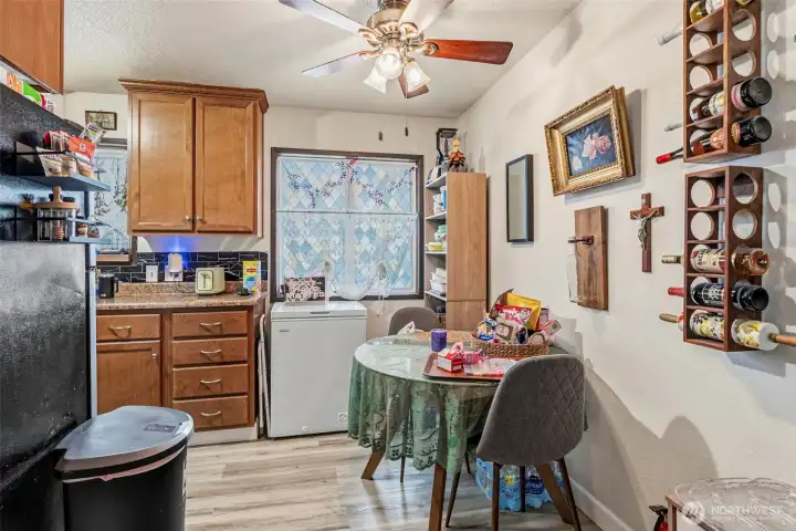 Step inside to a functional layout, featuring a seamless flow from the front entrance into the dining space and galley kitchen