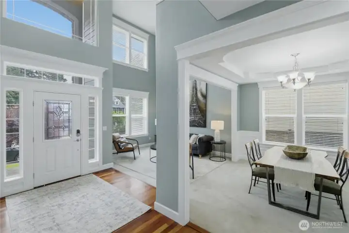 Stunning entry with lots of natural light and vaulted ceilings are sure to impress.