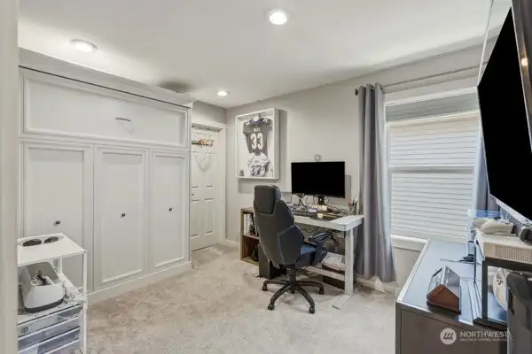 2nd bedroom currently being used as an office. Walk in closet here too as well as a murphy bed,it remains with the home (no mattress) 2nd bedroom currently being used as an office. Walk in closet here too as well as a murphy bed,it remains with the home (no mattress)