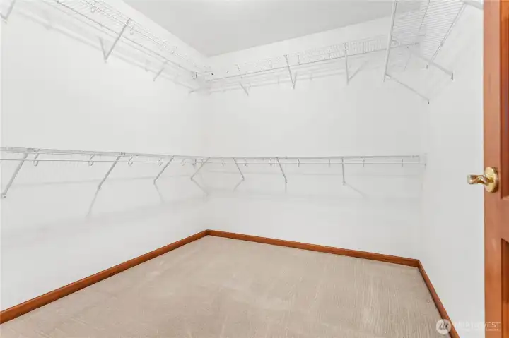 Primary bedroom walk-in closet