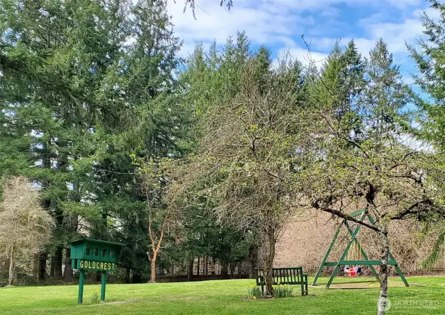 The Goldcrest park feaures a small playground, green space and a free book library